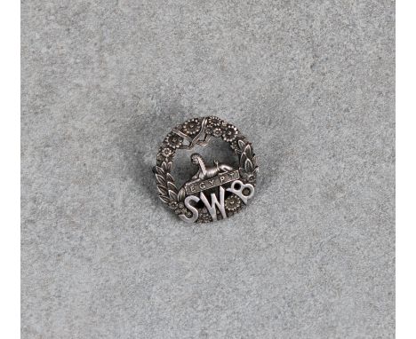 A hallmarked silver South Wales Borders cap badge  J R Gaunt &amp; Son, Birmingham, 1939.  