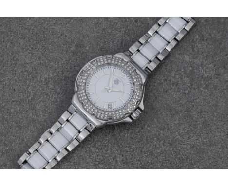 A TAG Heuer Formula 1 stainless steel, ceramic and diamond ladies quartz bracelet watch  ref. WAH 1215, c.2011, the white dia