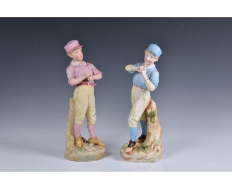 A rare pair of German Heubach biscuit porcelain figures of baseball players  c.1890, the batter wearing pink, pitcher in blue