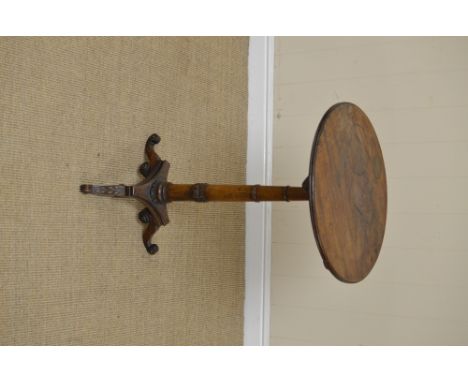 An early 19th Century mahogany tilt-top Table in the manner of George Bullock, with gun barrel and carved column and standing