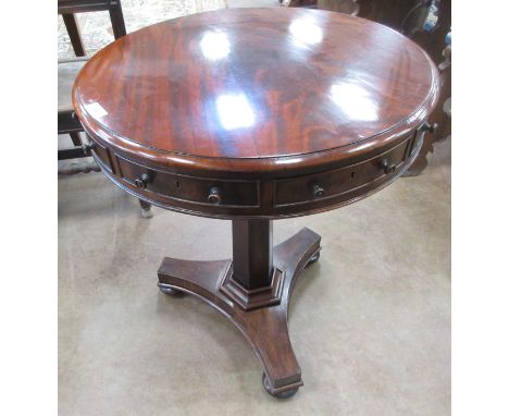 A 19th Century mahogany circular Drum Table fitted three frieze drawers and three dummy drawers, on hexagonal column and trip