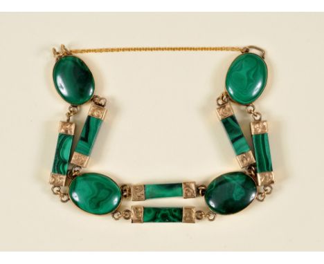 A 19th Century Malachite Bracelet set oval and baton shaped links in yellow metal engraved mounts. AMENDMENT: revised estimat