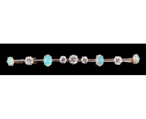 An early 20th Century Diamond and Opal Bar Brooch claw-set five old-cut diamonds and four oval opal cabochons to knife blade 