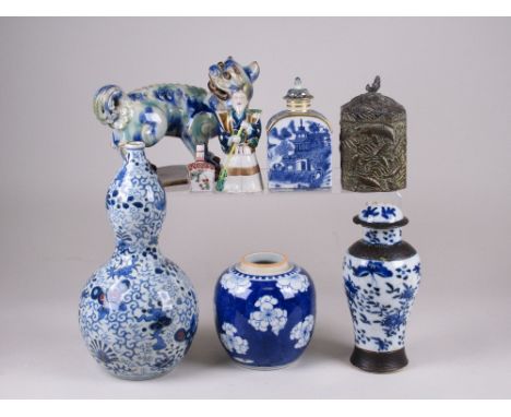 A group of Asian Ceramics, including a double gourd vase, Buddhistic lion, arched top tea caddy and a Japanese metal tea cani