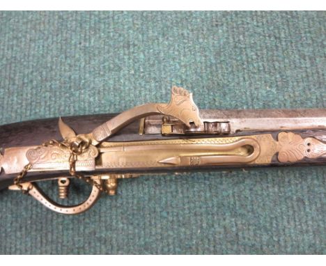 A South East Asian matchlock Rampart Gun, very well made throughout. The heavy 59in barrel of quality damascus steel. Engrave