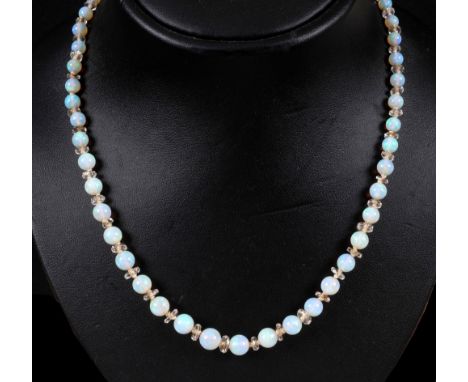 An Opal graduated Bead Necklace with faceted crystal spacers between each bead