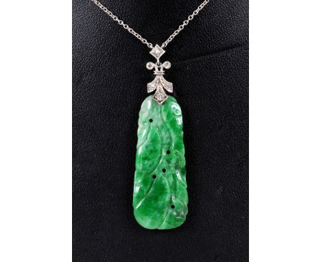 A Jade and Diamond Necklace with carved and pierced plaque suspended from trefoil mount millegrain-set five eight-cut diamond