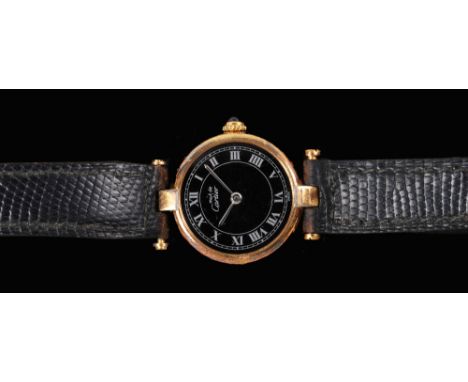 A Lady's Must de Cartier quartz Wristwatch, the black dial with roman numerals in silver gilt case on black lizard strap, no 