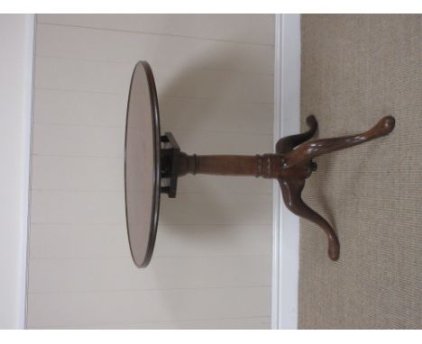 A Georgian mahogany Pillar Table with dished top, birdcage support and turned column, raised on tripod support with pad feet,