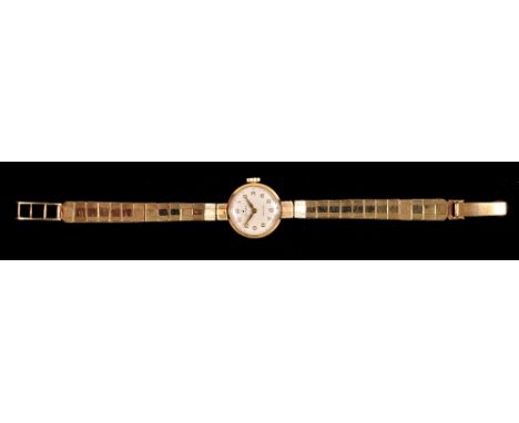 A Lady's Rolex Precision manual Wristwatch, the cream dial with gold hands and applied arabic numerals on 9ct gold integral b