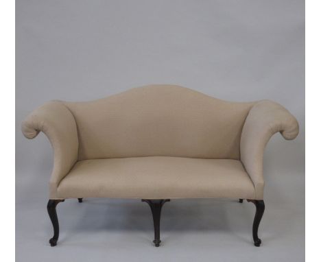 A George III style mahogany Sofa, the padded serpentine top and overscrolled arms on carved cabriole legs, 5ft 10in W