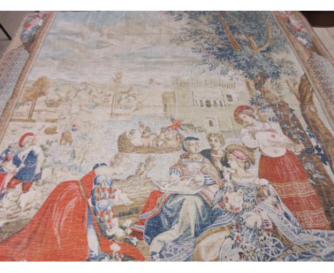 A Flemish Verdure Tapestry of figures and musicians in a garden with a boat on a lake and castle in the background, within a 