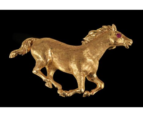 An 18ct gold galloping Horse Brooch with ruby cabochon eye, approx 6.50gms