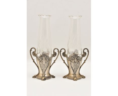A PAIR OF WMF ART NOUVEAU BUD VASES with pewter bases and cut glass inserts, scrolling foliate handles to each side height 22