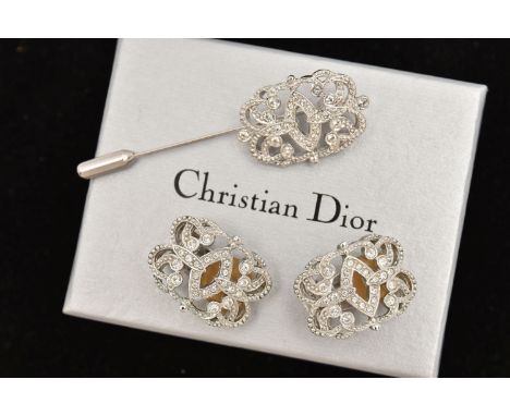 A 'CHRISTIAN DIOR' EARRING AND STICK PIN SET, a pair of earrings, white metal rectangular form art deco style design set with
