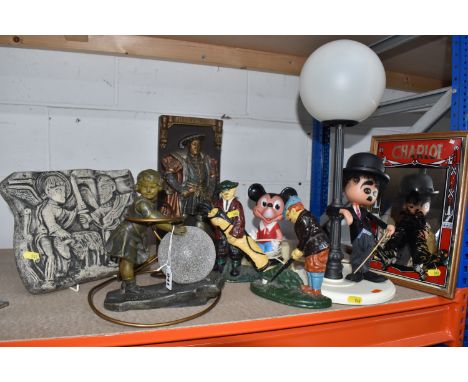 A GROUP OF DECORATIVE AND NOVELTY ORNAMENTS comprising two painted cast-iron door stops, a reproduction A.J. Scotte lamp of a
