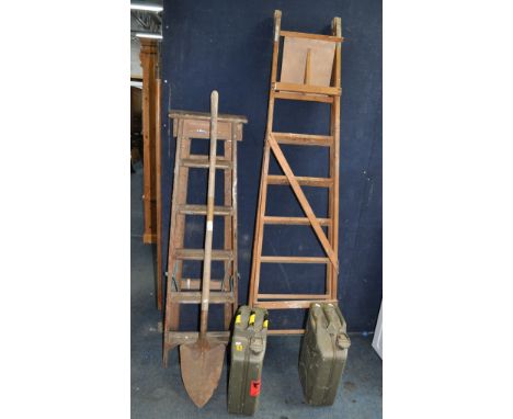 TWO VINTAGE WOODEN STEP LADDERS, the tallest being 201cm, a vintage post shovel and two 'jerry' cans (5)