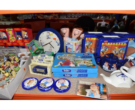 A GROUP OF TETLEY'S TEA ADVERTISING ITEMS, to include Wade cookie jars, biscuit tins, clocks, collectable figures, lunch boxe