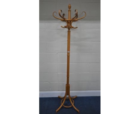 A THONET STYLE BEECH COAT / HAT STAND, with six arms, raised on four splayed legs, height 190cm, condition report: general si