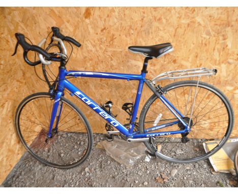 A CARRERA ZELOS ROAD RACING BIKE, with 14 speed Shimano gears, 21in frame, rear rack and Cinelli hand rests to bars