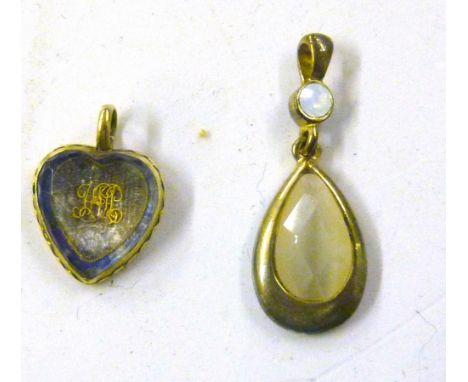 An opal set locket and a heart shaped locket