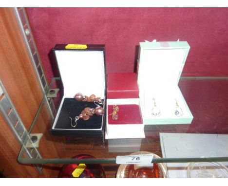 A pair of 9ct gold amethyst set earrings and two other pairs of earrings