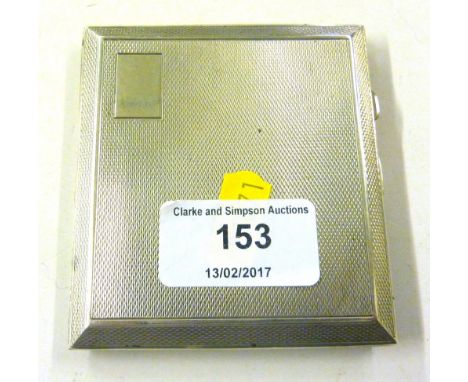 A silver engine turned cigarette case
