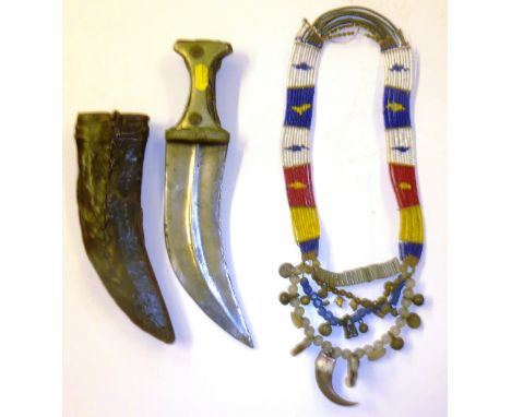 A Middle Eastern dagger and an Indonesian necklace