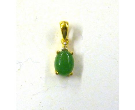 A sterling silver and gold overlaid pendant set with green jade and natural Cambodian zircon