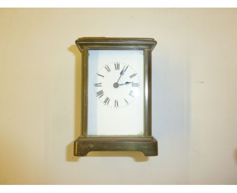 A brass cased carriage clock with key