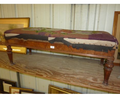 A Victorian walnut and tapestry upholstered stool with lift up top
