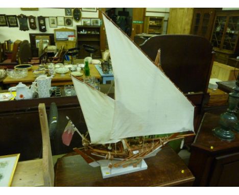 A wooden and painted model of an Arab dhow