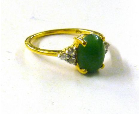 A sterling silver and gold overlaid ring set with green jade and natural Cambodian zircon