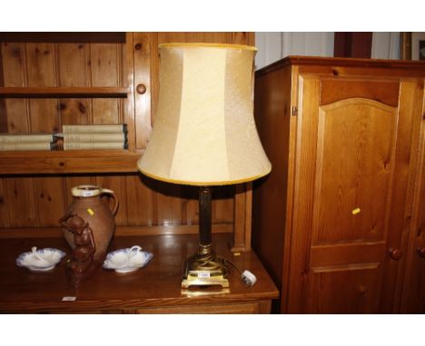 A brass Corinthian column table lamp and shade 