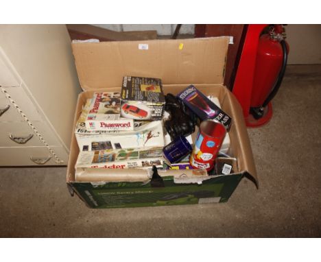 A large box containing various vintage toys, commemorative mug, ornamental football bot etc.