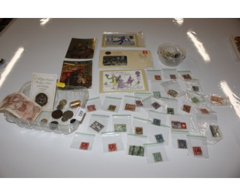 A collection of stamps, coins and First Day covers 