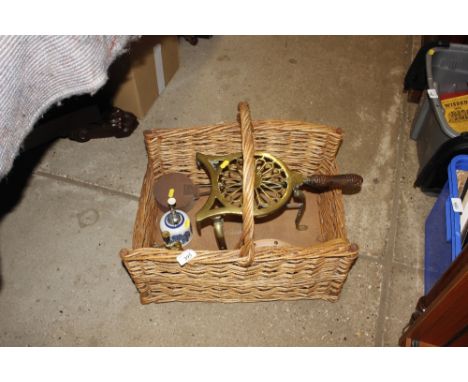 A chestnut roaster and a brass trivet; a pair of bellows; two vintage sprayers; and a wicker log basket 