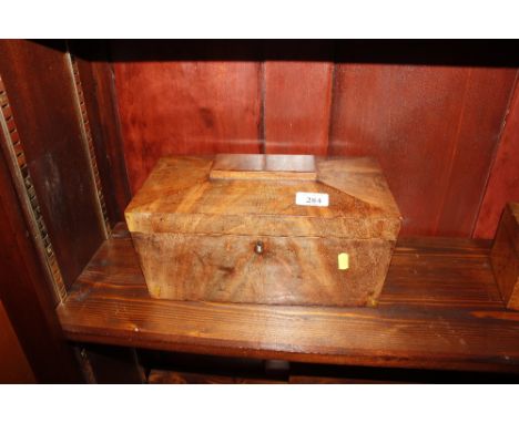 A 19th Century mahogany sarcophagus shaped tea caddy with replacement glass liner 