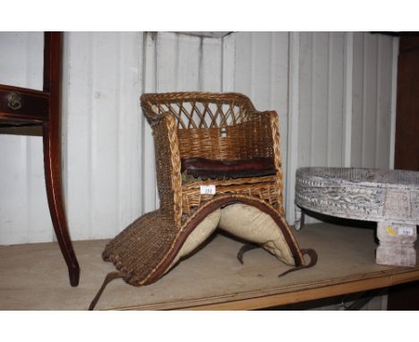 A vintage wicker child's saddle