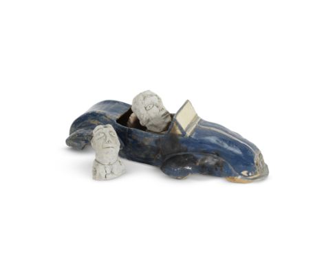 A glazed pottery model of a blue sports car, together with two clay modelled busts reputedly made by Sir Terence Conran, Sir 