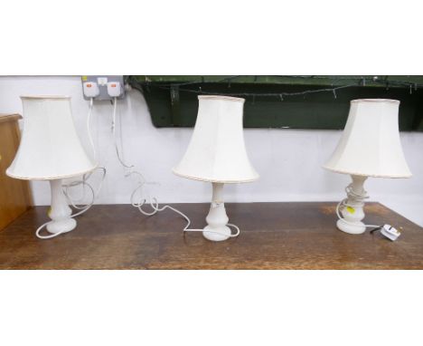 Three matching lamps with marble style column bases, by Oakes Lighting, each measure 43 cm high