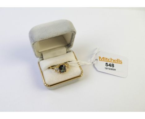 9 ct gold ring with Alaska Aurora lite genuine topaz stone, +/- 4 grams
