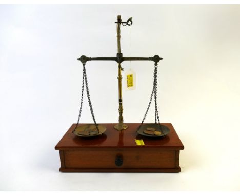 Set of postal scales with wooden base an drawer beneath with weights