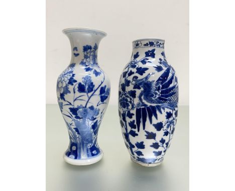 Two Chinese blue and white vases: the first of baluster form with everted rim, painted with flowering boughs, with four chara