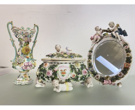 A group of floral-encrusted porcelain, 19th century, comprising: a Coalbrookdale style twin-handled vase, of baluster form, u