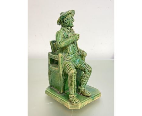 A rare Scottish green-glazed figure of Tam O'Shanter, third quarter of the 19th century, probably Dunmore pottery, unmarked. 