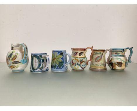 A group of Bourne (Denby) stoneware designed by Glyn Colledge comprising: three baluster jugs, each painted with leaves, sign