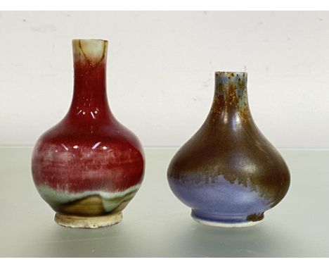 Two small Chinese vases, one stoneware, of flask form, with a speckled glaze of Juanyao type in blue, olive, brown and lilac,