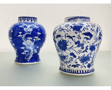 Two Chinese blue and white porcelain baluster jars: the first profusely painted with birds, insects and flowers against a whi