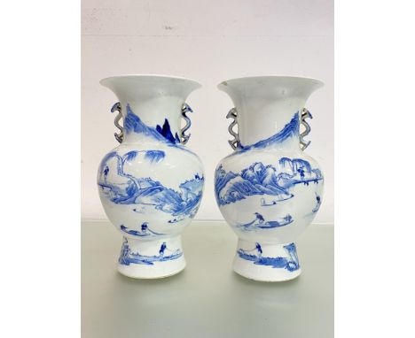 A pair of Chinese blue and white porcelain vases, of baluster form, each with six character mark of Kangxi type, painted with